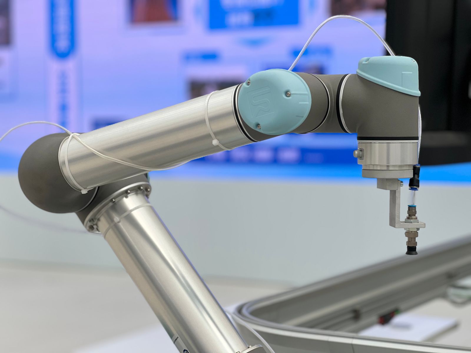 Close-up of a precision collaborative robotic arm, representing the engineered reliability behind Laplasco's machinery
